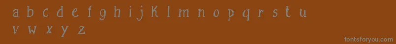 Czcionka FreesketchingFreeDemo – szare czcionki na brązowym tle