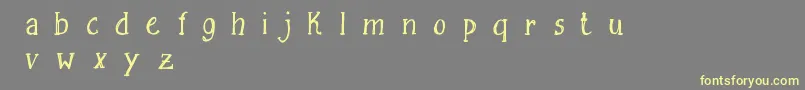 Шрифт FreesketchingFreeDemo – жёлтые шрифты на сером фоне