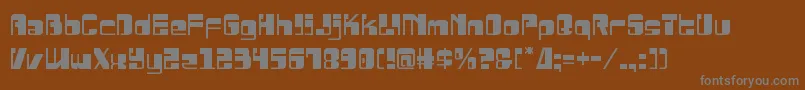 Drosselmeyer-fontti – harmaat kirjasimet ruskealla taustalla