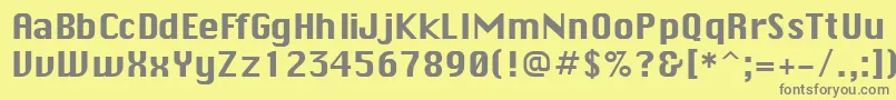 MacenvyRegularDb-fontti – harmaat kirjasimet keltaisella taustalla