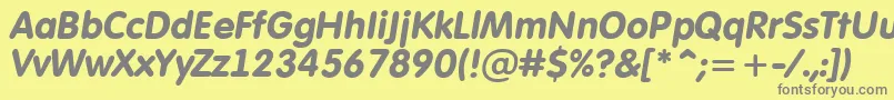AFuturaroundBolditalic-fontti – harmaat kirjasimet keltaisella taustalla