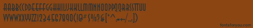 フォントAnnaItcTt – 黒い文字が茶色の背景にあります