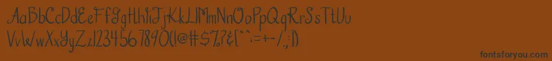 AustieBostHookedOnAFeeling Font – Black Fonts on Brown Background