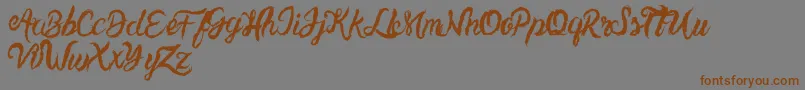 UnlimitedtoppingsScript Font – Brown Fonts on Gray Background