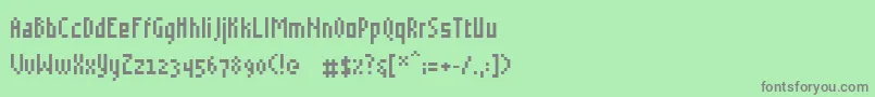 フォントGrudblitter – 緑の背景に灰色の文字