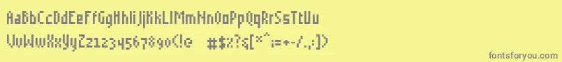 Grudblitter-fontti – harmaat kirjasimet keltaisella taustalla