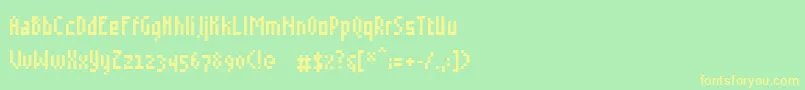 フォントGrudblitter – 黄色の文字が緑の背景にあります