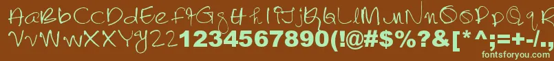 フォントLalithabai – 緑色の文字が茶色の背景にあります。