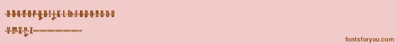 Fonte FtKolariDemoLight – fontes marrons em um fundo rosa