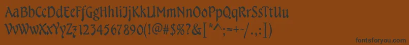 TampicoRegular-fontti – mustat fontit ruskealla taustalla