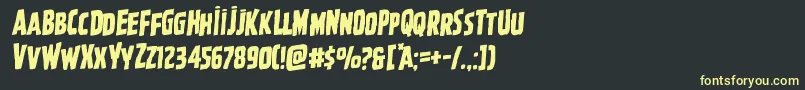 フォントGhoulishintentrotal – 黒い背景に黄色の文字