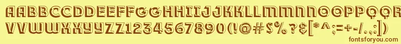 Race1BranntPlusChiseledNcv-Schriftart – Braune Schriften auf gelbem Hintergrund