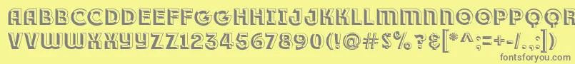 Race1BranntPlusChiseledNcv-Schriftart – Graue Schriften auf gelbem Hintergrund