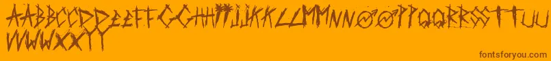 Czcionka ScratchedCarPaint – brązowe czcionki na pomarańczowym tle
