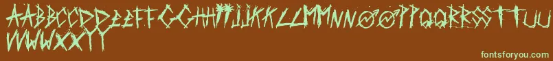 フォントScratchedCarPaint – 緑色の文字が茶色の背景にあります。