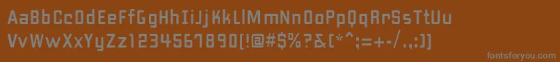 Fonte PfhipsterUnicode – fontes cinzas em um fundo marrom