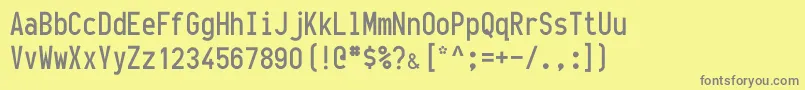 フォントOneslot – 黄色の背景に灰色の文字