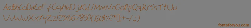 フォントEdSnowden – 茶色の文字が灰色の背景にあります。