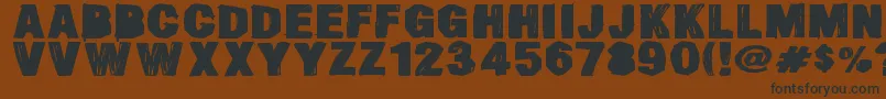 SmearedDsg Font – Black Fonts on Brown Background