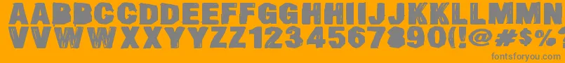 フォントSmearedDsg – オレンジの背景に灰色の文字