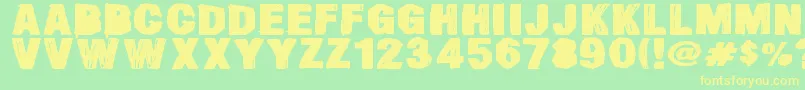 フォントSmearedDsg – 黄色の文字が緑の背景にあります