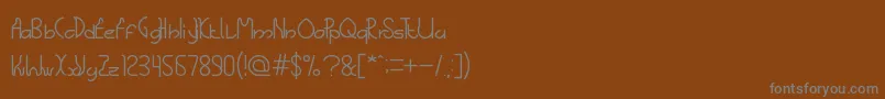 フォントTheScienceArchaeologist – 茶色の背景に灰色の文字