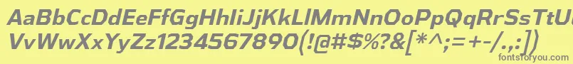AthabascaBdIt-fontti – harmaat kirjasimet keltaisella taustalla