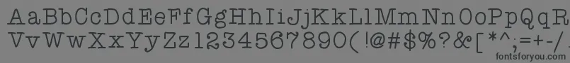 Atypewriterforme-Schriftart – Schwarze Schriften auf grauem Hintergrund