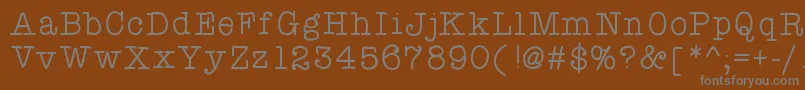 フォントAtypewriterforme – 茶色の背景に灰色の文字