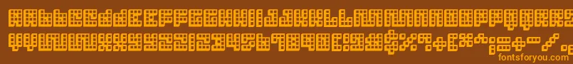 フォントTrick 3D – オレンジ色の文字が茶色の背景にあります。