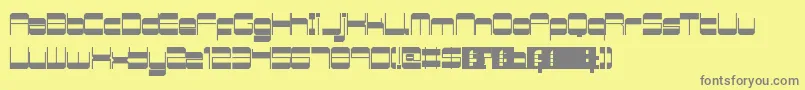 RetroMania-fontti – harmaat kirjasimet keltaisella taustalla