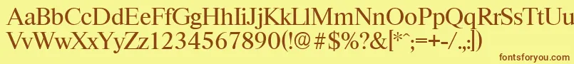 フォントRiccioneserialRegular – 茶色の文字が黄色の背景にあります。
