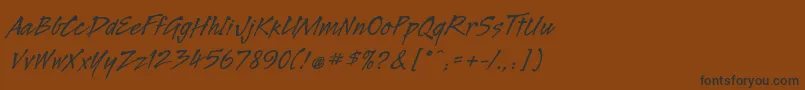 フォントLegaultstd – 黒い文字が茶色の背景にあります