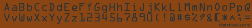 フォントOcraMedium – 黒い文字が茶色の背景にあります