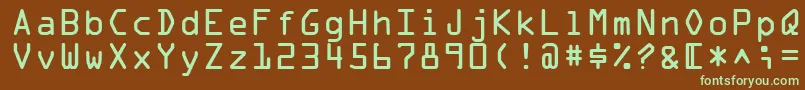 フォントOcraMedium – 緑色の文字が茶色の背景にあります。