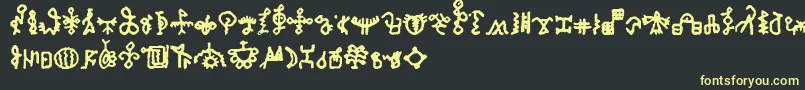 フォントBamumSymbols1 – 黒い背景に黄色の文字