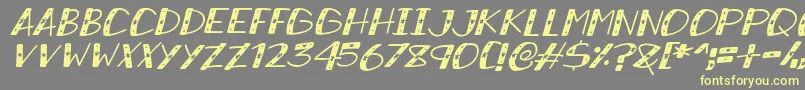 SnowySparklesItalic-fontti – keltaiset fontit harmaalla taustalla