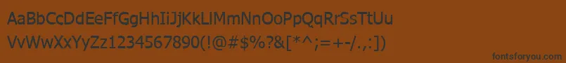 フォントWebtamilNormal – 黒い文字が茶色の背景にあります
