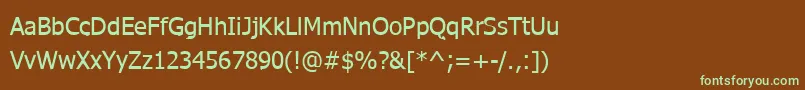 フォントWebtamilNormal – 緑色の文字が茶色の背景にあります。
