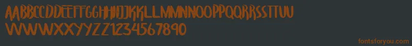 TroupersCapitals-Schriftart – Braune Schriften auf schwarzem Hintergrund