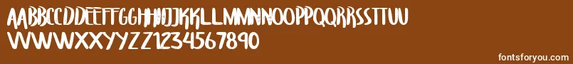Fonte TroupersCapitals – fontes brancas em um fundo marrom