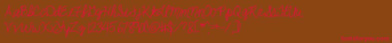 Jackiekcursive Font – Red Fonts on Brown Background