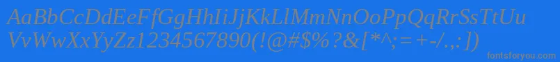 Czcionka TinosItalic – szare czcionki na niebieskim tle