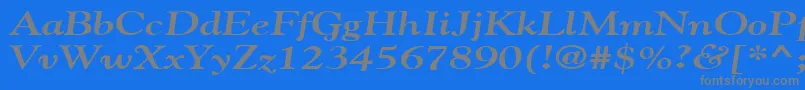 GildebroadBoldItalic-fontti – harmaat kirjasimet sinisellä taustalla