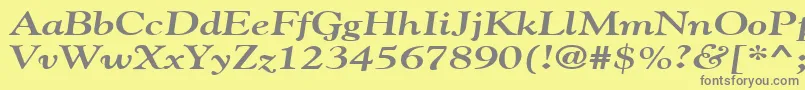 GildebroadBoldItalic-fontti – harmaat kirjasimet keltaisella taustalla