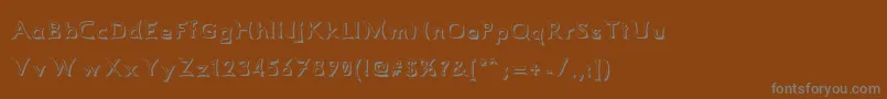 Comismsh Font – Gray Fonts on Brown Background