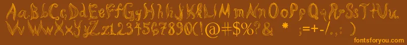 フォントKatasCornleaves – オレンジ色の文字が茶色の背景にあります。
