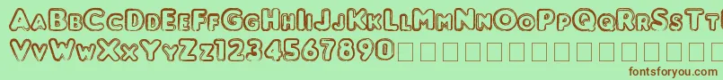 Punched-Schriftart – Braune Schriften auf grünem Hintergrund