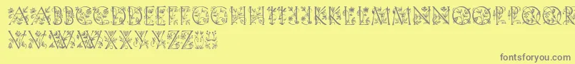 Gardendisplaycaps-fontti – harmaat kirjasimet keltaisella taustalla