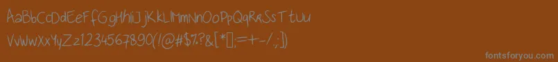 Saiba mais sobre a fonte Handwritingfont Fonte Handwritingfont – fontes cinzas em um fundo marrom